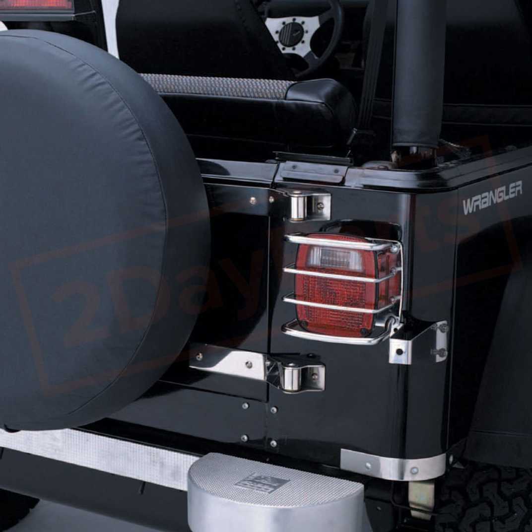 Image Smittybilt Tail Light Guard Euro Style Silver for Jeep CJ & Wrangler 76-06 part in Mouldings & Trim category